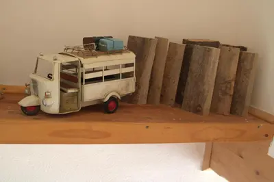 a toy truck parked next to a wooden fence at A View to a Hill in Sveti Florijan pri Šoštanju