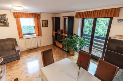 a living room with a table and chairs at Apartment Satya in Dobrna
