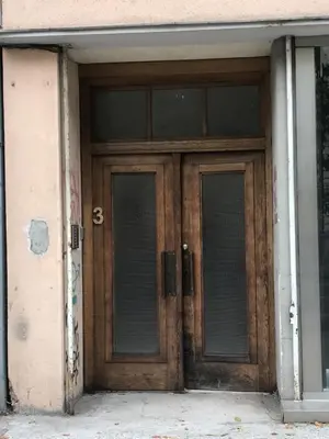 a pair of wooden doors in a building at Villa Sofija in Ljubljana