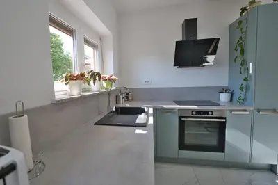 a kitchen with a sink and a stove at Hisa idej in Sežana