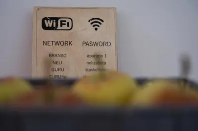 a box with a wifi sign next to some fruit at Hisa idej in Sežana