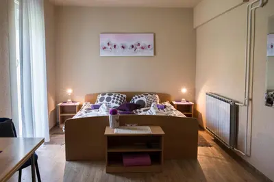 a living room with a couch and a table at Guest House Tara in Moravske Toplice