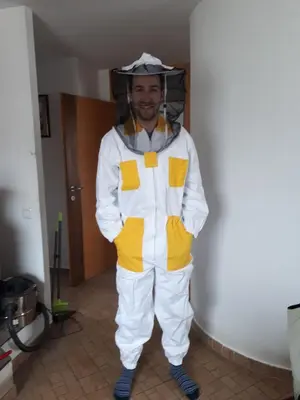 a man dressed in a yellow and white suit at Guest House Tara in Moravske Toplice