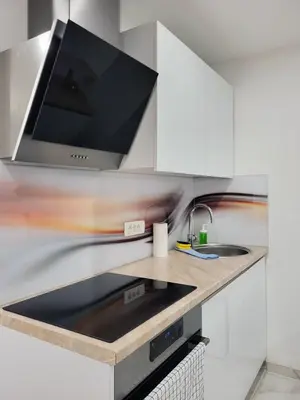 a kitchen with a sink and a microwave at Stara Pošta Apartment 5 in Grosuplje