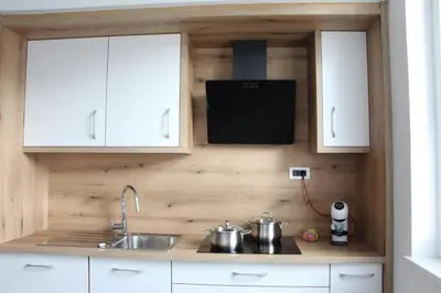 a kitchen with two pots and a sink at Apartment Simona in Kranjska Gora