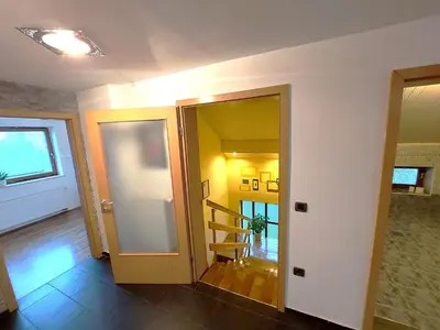 a hallway with two doors and a staircase in a room at Countryside Apartment Agnes in Šentjošt nad Horjulom