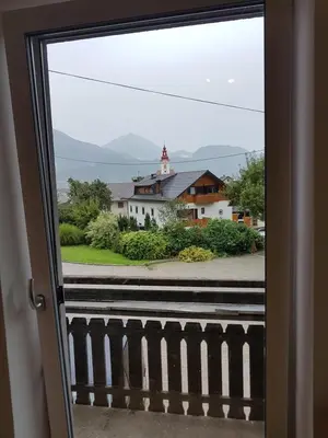 a view of a house from a window at Garden Apartments Maria in Bled