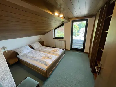 a bedroom with two beds and a window at Sara`s Guesthouse Bled in Bled