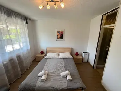 a bedroom with a bed with two towels on it at Sara`s Guesthouse Bled in Bled