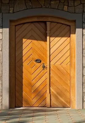 a wooden garage door in a building at Vineyard Cottage Lustek in Novo Mesto
