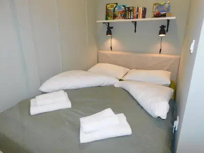 a room with two beds with white pillows at Cankar's cute apartment in Ljubljana