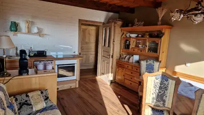 a kitchen with wooden cabinets and a counter top at Holiday House Clavis in Dobrovnik