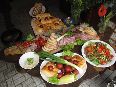 a table topped with plates of food on top thereof at Guesthouse Zorko Gostilna Domen in Smarjeske Toplice