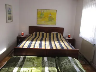 a bed in a bedroom with two twin beds at Guesthouse Zorko Gostilna Domen in Smarjeske Toplice