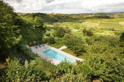 an aerial view of a villa with a swimming pool at Boutique Hotel Dvor in Dobrovo