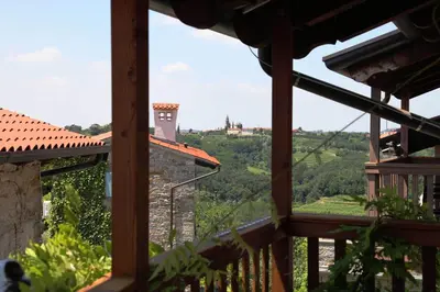 a view from the balcony of a house with a view at Boutique Hotel Dvor in Dobrovo