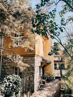 a building with a fence in front of it at Vila Del Linz in Ljubljana