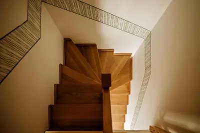 a staircase in a house with a mirror on the wall at Vineyard Cottage Zdolsek in Šmarje pri Jelšah