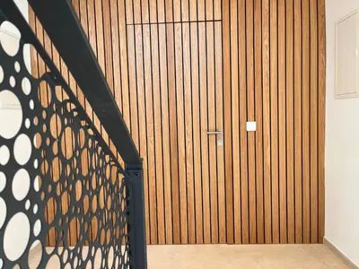 a room with a wooden wall with a door at Villa Boris in Starše