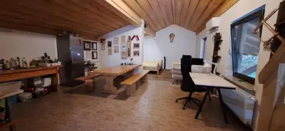 a room with a table and a desk with a computer at Prenočišče pri Sodarju in Beltinci