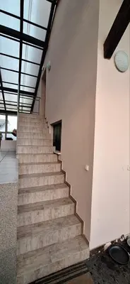 a stairway in a building with a stair case at Prenočišče pri Sodarju in Beltinci