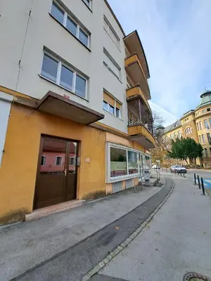 a building on the side of a street at Charming Celje City Center Apartment in Celje