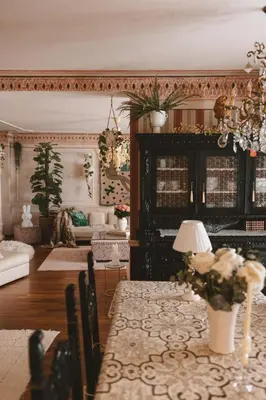 a living room with a table and a couch at Mondo Diverso in Ljubljana