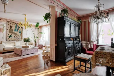 an ornate living room with a large black cabinet at Mondo Diverso in Ljubljana