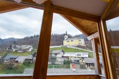 a view from a window of a town with a church at Apartment Ivanka Cvetek in Bohinj