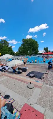 a group of people at a beach with a pool at Vila VALENTINA in Čatež ob Savi