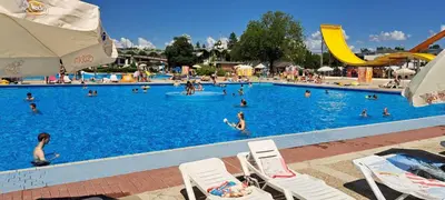 a large swimming pool with many people in it at Vila VALENTINA in Čatež ob Savi