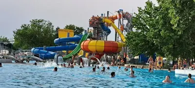 a group of people in a pool at a water park at Vila VALENTINA in Čatež ob Savi