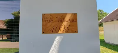 a sign on the side of a house at Vila VALENTINA in Čatež ob Savi