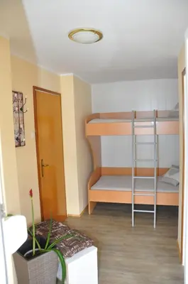 a small room with two bunk beds in it at Apartment Maruška in Tolmin