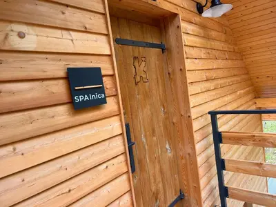a door to a log cabin with a sign on it at Posest Kunigunda in Šmartno v Rožni Dolini
