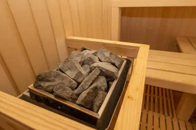a box of rocks sitting in a sauna at MARRYS APARTMENTS in Polica