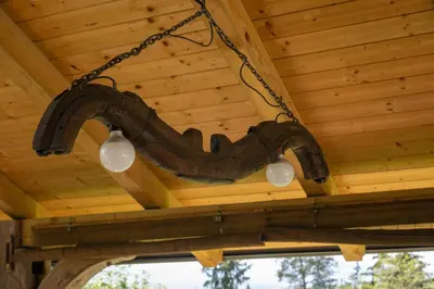 a chandelier hanging from the ceiling of a cabin at MARRYS APARTMENTS in Polica