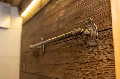 a metal door handle on a wooden door at MARRYS APARTMENTS in Polica