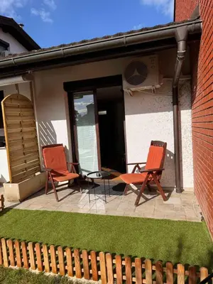 two chairs and a table on a patio at Apartma Galjevica in Ljubljana