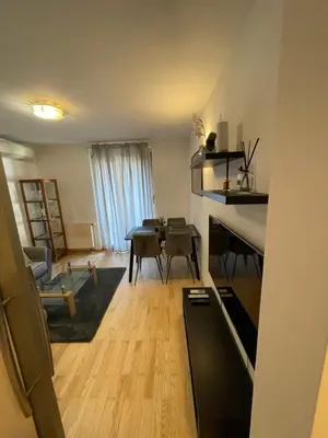 a living room with a table and a dining room at Apartma Galjevica in Ljubljana