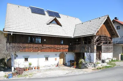 a house with solar panels on the roof at Apartment Sonca in Bled