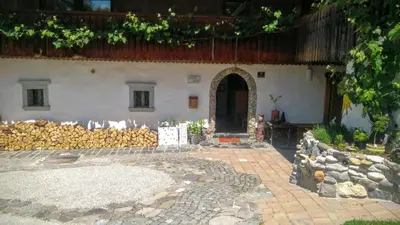 an entrance to a house with a fence and a building at Apartment Sonca in Bled