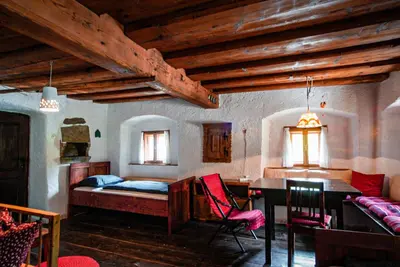 a bedroom with a bed and a desk and a table at Apartment Sonca in Bled