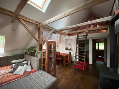 a living room with a loft bed and a table at Stunning Hills View Apartment Vransko in Vransko
