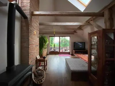 a living room with a fireplace and a brick wall at Stunning Hills View Apartment Vransko in Vransko