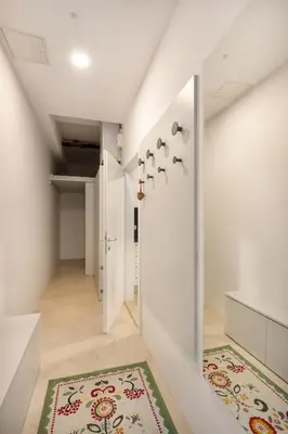a hallway with a door and a rug at Apartma Juniper in Kranjska Gora