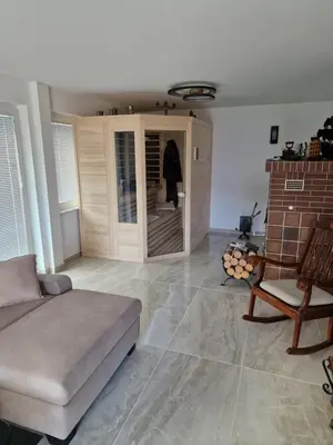 a living room with a couch and a chair at Apartments Boldin in Bled