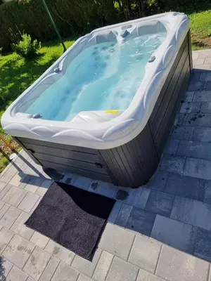 a large bath tub sitting on a patio at Apartments Boldin in Bled