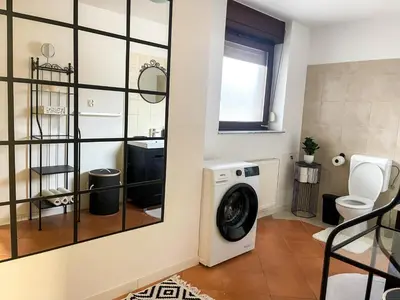 a laundry room with a washer and dryer at Spacious Cozy apartment in Ljubljana