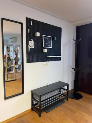 a mirror and a table in a room at Spacious Cozy apartment in Ljubljana